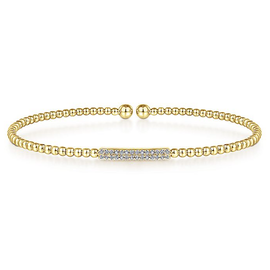 Sweet and delicate are the descriptors that come to mind when you see this 14k diamond bangle. In the center are rows of tiny, simple diamonds to create a glamourous and subtle look. This bracelet can be worn by itself or combined with other bracelets to go with whatever look you are going for.  