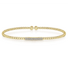 Sweet and delicate are the descriptors that come to mind when you see this 14k diamond bangle. In the center are rows of tiny, simple diamonds to create a glamourous and subtle look. This bracelet can be worn by itself or combined with other bracelets to go with whatever look you are going for.  