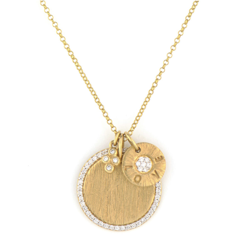 From the Provence Collection, the Provence Medium Pave Disc & Love Disc Engravable Pendant features pave round diamonds set in 18K yellow gold with the signature brushed JFJ finish. Pendant accents with a bezel set hanging diamond quad and engraved LOVE diamond circle. Pendant sold on delicate rolo chain. 18 Inches.
