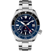 This Seiko Prospex LX SNR033 GMT watch has a 44.8mm titanium case with a blue dial and a blue and black rotating bezel. The hands and dial markers have LumiBrite increasing visibility against the dark dial or while diving. The term LX for this model and others in the collection pays tribute to how light reflects off of the dial. It is a GMT meaning the wearer can view two different time zones at once. The watch is powered by 5R66 calibre with spring drive. It has a water resistance up to 100 met