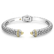 Sterling silver Caviar beading comprises this innovative cuff bracelet detailing faceted 18K gold end caps. Finished with a hinge clasp.- Sterling Silver & 18K Gold- Hidden Hinge Clasp- Band Width 8mm Tapers to 6mm- Gold Endcap - 5mm- STYLE #: 05-81303-M