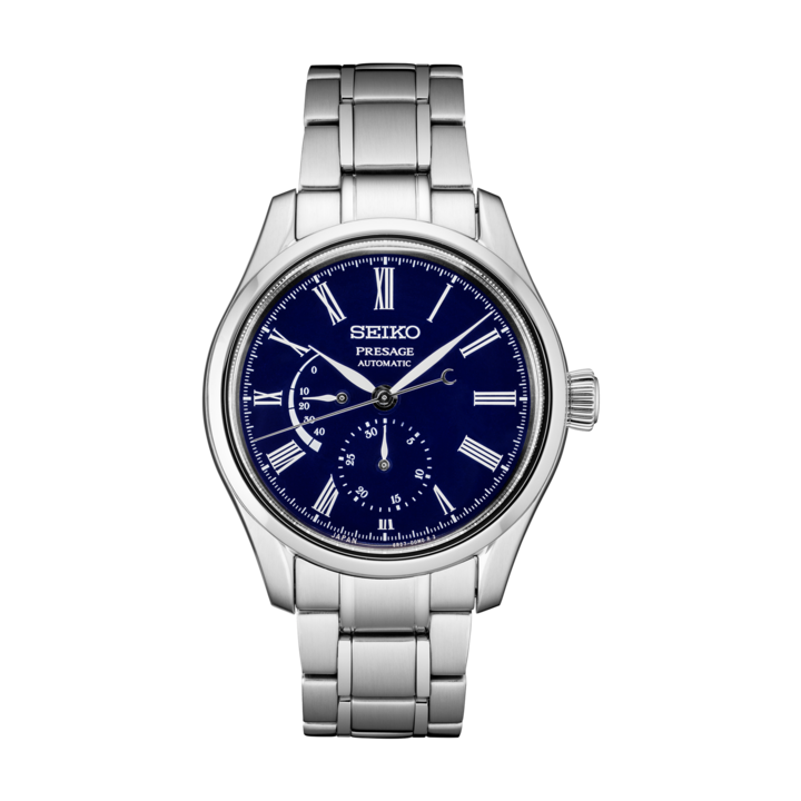 This model has a 40.5mm stainless steel case with a lot of functionality showcased on the dark blue dial. In addition to the bright white roman numeral markers and hands, this watch showcases hours, minutes, seconds, power reserve level, and stop seconds hand function. It is powered by the 6R27 calibre automatic movement with manual winding capacity. 