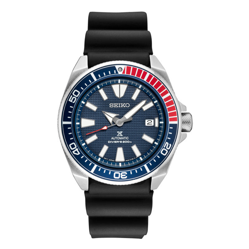 Seiko diver with a blue and red bezel with a blue textured dial. This piece is on a black silicone strap. The 44mm case features the 4R35 movement. The screwdown crown and date window are both positioned at the 3 oclock position.