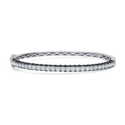 This gorgeous bangle bracelet is unlike any ordinary diamond bracelet. It has 1.79 carat total weight of G-H color white diamonds sparkling from both the top. On the sides of the bracelet, there are 3.00 carat total weight black diamonds. 