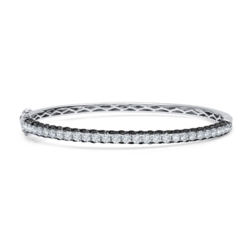 This gorgeous bangle bracelet is unlike any ordinary diamond bracelet. It has 1.79 carat total weight of G-H color white diamonds sparkling from both the top. On the sides of the bracelet, there are 3.00 carat total weight black diamonds. 