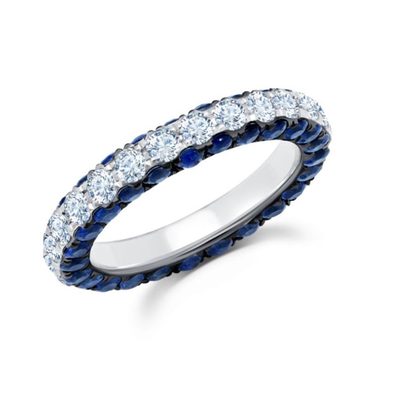 This 18K white gold band is not your average diamond band! From the top, 1.62 carat total weight G-H color white diamonds sparkle brilliantly. On the sides, the wearer gets the view of 2.91 carat total weight blue sapphire. 