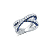 This 18K white gold x ring has 2.98 carat total weight blue sapphires and 1.83 carat total weight G-H color white diamonds. White diamonds sparkle from the front of the ring, and on the side profiles of the ring, blue sapphires accent the diamonds. 