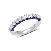 This 18K white gold band is not your average diamond band! From the top, 0.71 carat total weight G-H color white diamonds sparkle brilliantly. On the sides, the wearer gets the view of 1.26 carat total weight blue sapphires. 